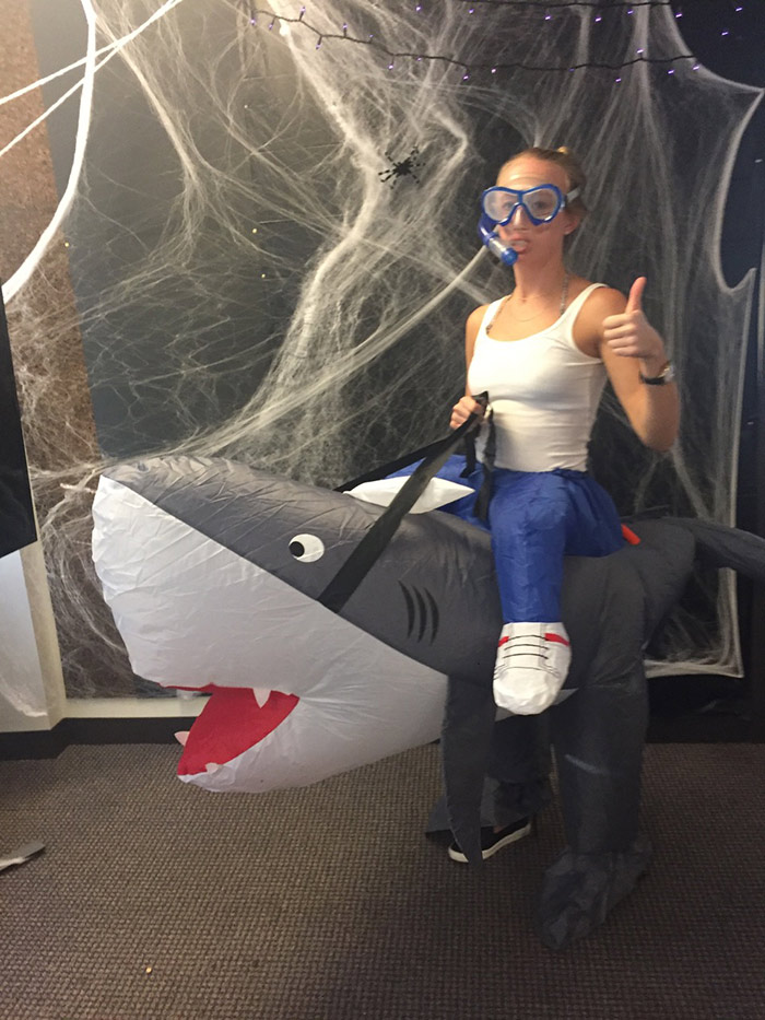 Erin riding a shark